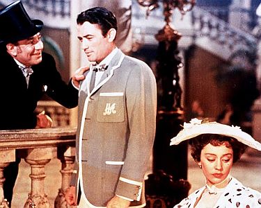 "Sein grter Bluff": Szenenfoto mit Gregory Peck (Mitte) als Henry Adams und Jane Griffiths (19291975) als Portia Lansdowne; mit freundlicher Genehmigung von "Pidax Film", welche die Komdie Mitte Mrz 2021 auf DVD herausbrachte.