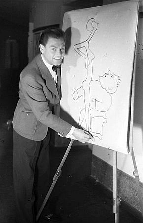 Jupp Hussels 1938 im "Kabarett der Komiker" am Zeichenpult; Urheber: Willy Pragher; Lizenz: CC BY 3.0; Rechteinhaber: Landesarchiv Baden-Wrttemberg; Quelle: Deutsche Digitale Bibliothek bzw. Wikimedia Commons