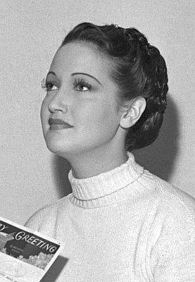 Dorothy Lamour im Dezember 1938; Quelle: Wikimedia Commons (Ausschnitt des Originalfotos) von "UCLA Library Digital Collection"; Urheber: "Los Angeles Times"; Lizenz: CC BY 4.0 Deed